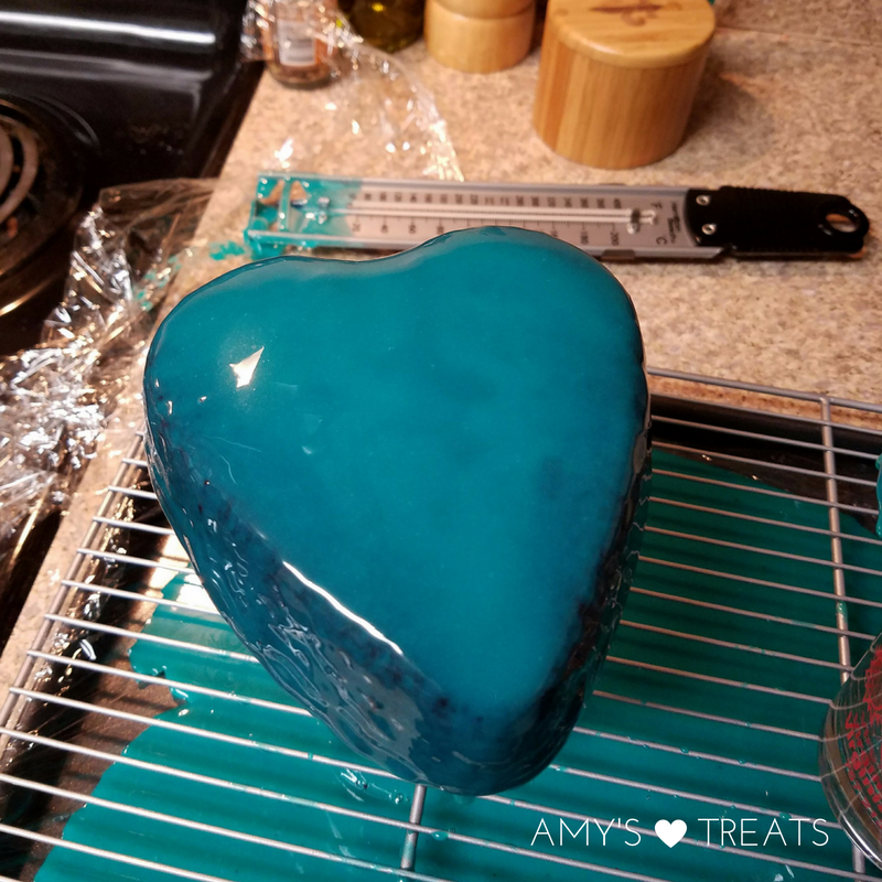 Pour your mirror glaze over your mirror cake. 